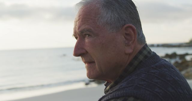 Elderly Man Reflecting by the Ocean at Sunset - Download Free Stock Images Pikwizard.com