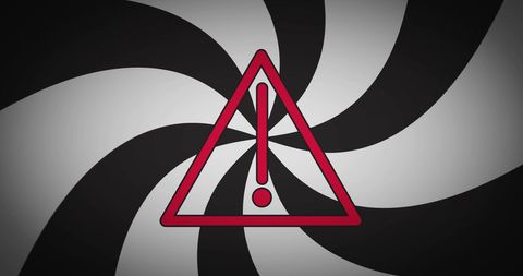 Warning triangle on twisted black and white background