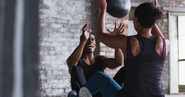 Two Women Working Out Together with Medicine Ball in Gym - Download Free Stock Images Pikwizard.com