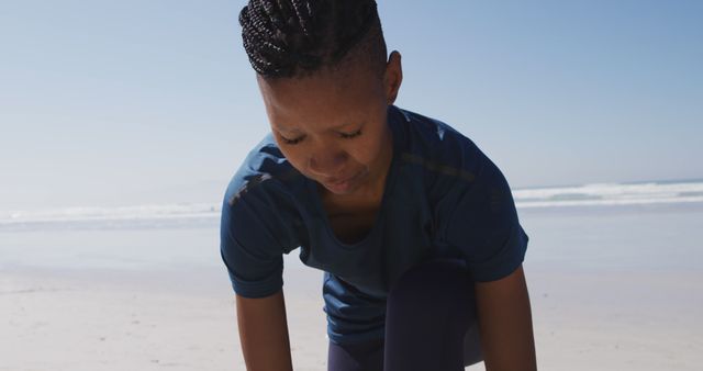 Person Preparing for Outdoor Exercise on Beach - Download Free Stock Images Pikwizard.com