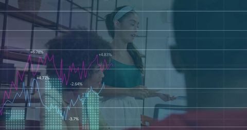 team analyzing financial trends with overlaid graphs - Download Free Stock Images Pikwizard.com