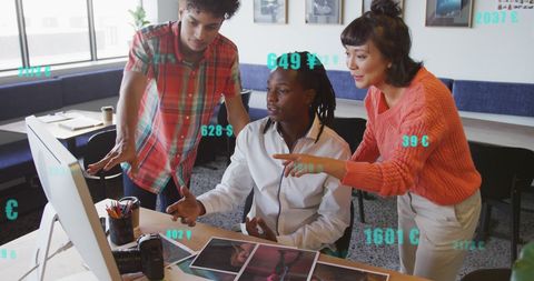 Diverse Team Analyzing Financial Data on Computer