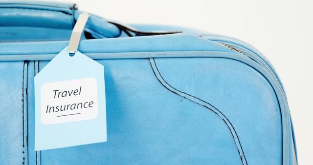 A blue suitcase features a tag labeled Travel Insurance, indicating the importance of securing belongings and trip investments. Travel insurance provides peace of mind for unexpected events during journeys.