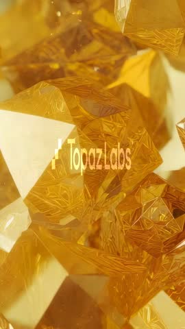 Rotating Gold Crystal Gems Revealing TopazLabs Logo — Faceted Reflective Gem Motion Loop