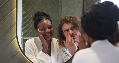 Happy Couple in Front of Mirror Sharing Moments at Home