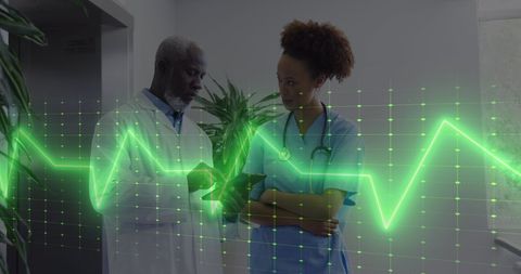 Healthcare Professionals Analyzing Data with Heart Rate Monitor Overlay - Download Free Stock Images Pikwizard.com