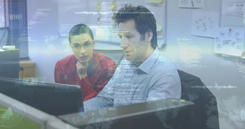 Collaborating team analyzing digital analytics on monitors with futuristic hud overlay