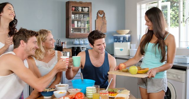 Friends Enjoying Breakfast Together in Kitchen, Celebrating Friendship - Download Free Stock Images Pikwizard.com