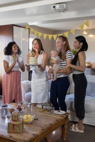 Diverse Female Friends Celebrating 30th Birthday with Cake