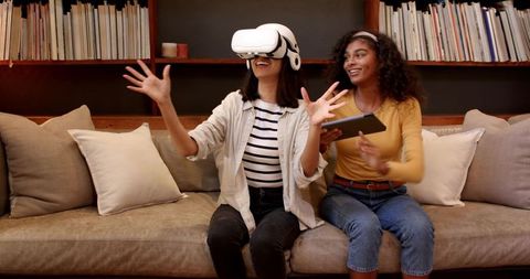 Diverse Friends Enjoying Virtual Reality Gaming Together at Home