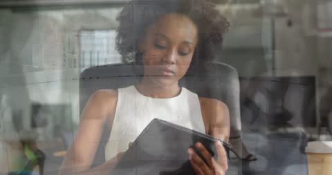 Young Businesswoman Using Tablet with Digital Interface Overlay