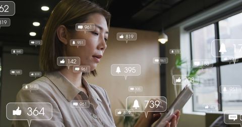 asian businesswoman engaging with digital notifications - Download Free Stock Images Pikwizard.com