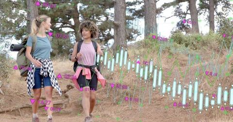 Two Women Hiking Through Pine Trail Carrying Backpacks with Financial Data Overlay