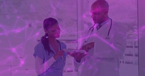 Doctors Collaborating Over Digital Technology in Modern Healthcare