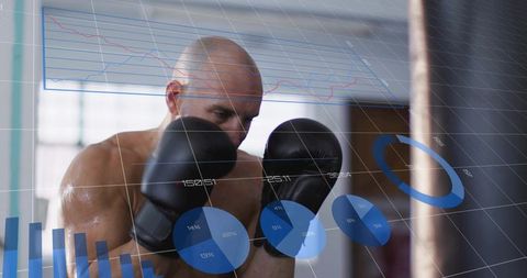 Shirtless boxer training with data analytics overlay on heavy bag for performance tracking