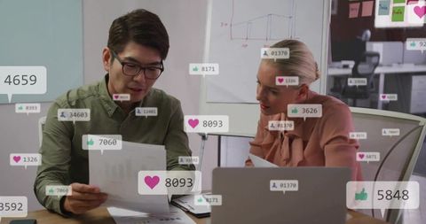 Analyzing social media metrics in modern office meeting with charts and engagement