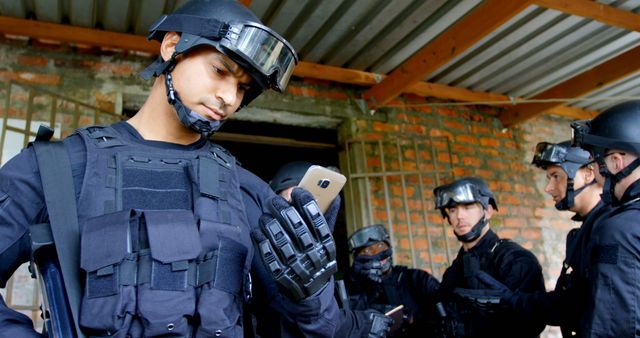 Tactical Police Team Using Smartphone during Operation - Download Free Stock Images Pikwizard.com