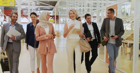 Diverse business team walking through modern office