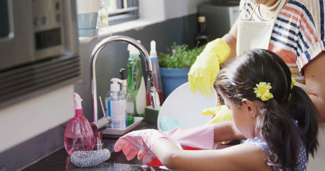 Mother and Daughter Washing Dishes in Kitchen Together - Download Free Stock Images Pikwizard.com