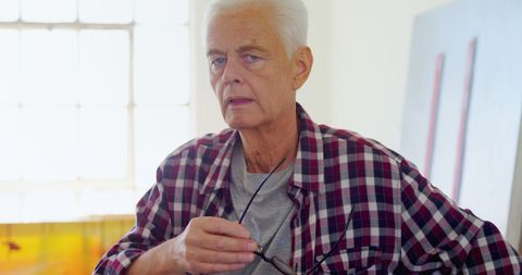 Senior Man Contemplating Holding Glasses at Home - Download Free Stock Images Pikwizard.com