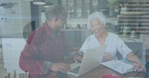 Senior african american couple managing finances at home