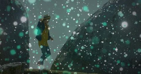 Adventurous Hiker Traversing Snowy Cliff with Majestic Boulders