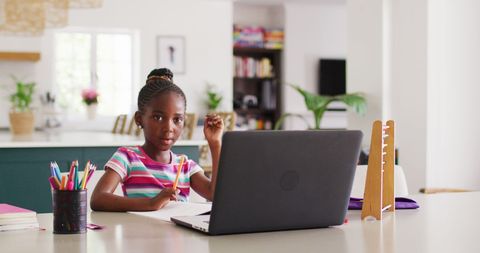 Young African American Girl Participating in Online Class from Home - Download Free Stock Images Pikwizard.com