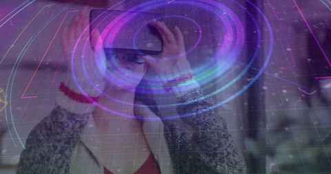 Woman using vr headset imagining futuristic technology vision