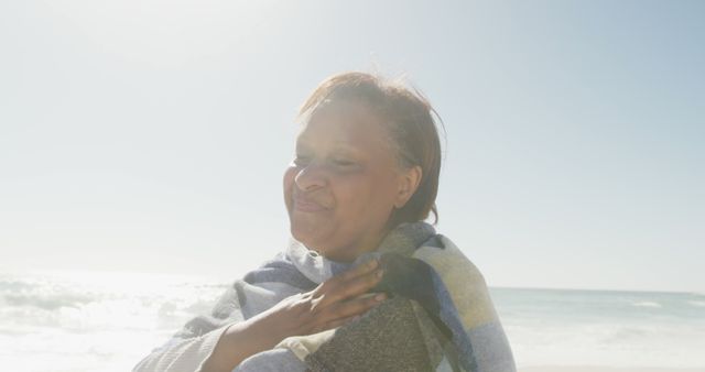 Woman Enjoying a Sunny Day at the Beach - Download Free Stock Images Pikwizard.com