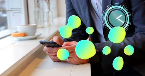 Caucasian businessman using smartphone with digital interface graphics