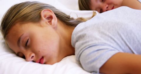 Peaceful Siblings Sleeping in Cozy Bed - Download Free Stock Images Pikwizard.com