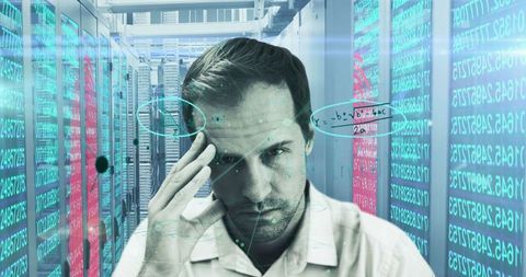 Man Analyzing Data in High-Tech Server Room with Digital Overlay