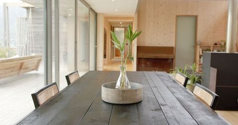 Minimalist Dining Space with Wooden Table and Outdoor View