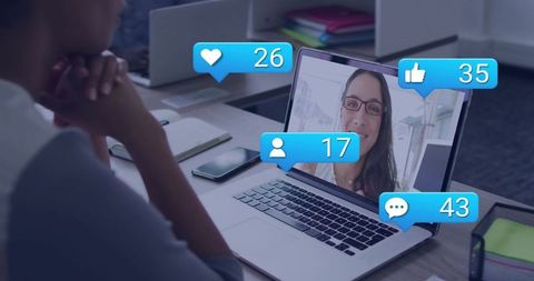 Person watching laptop during virtual meeting with social likes comments follower counts