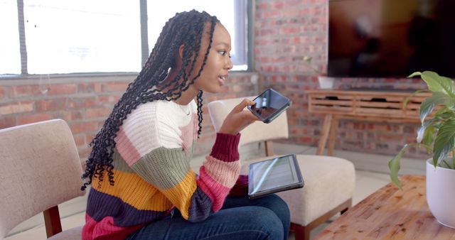 Young Woman Working from Home Using Tablet and Smartphone - Download Free Stock Images Pikwizard.com