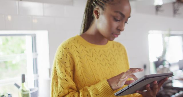 Young Woman Using Tablet in Cozy Kitchen - Download Free Stock Images Pikwizard.com