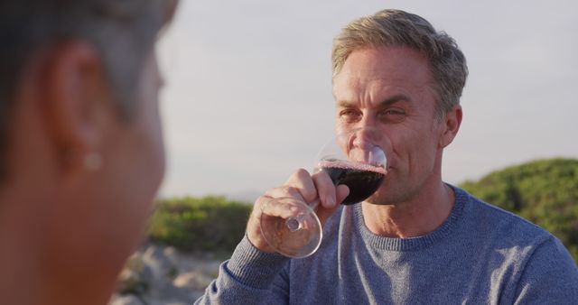 Man Enjoying Red Wine in Outdoor Setting - Download Free Stock Images Pikwizard.com