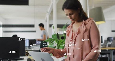 Digital Networking Woman in Open Office with Overlaid Metrics