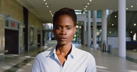 Confident Businesswoman Standing in Modern Office Building
