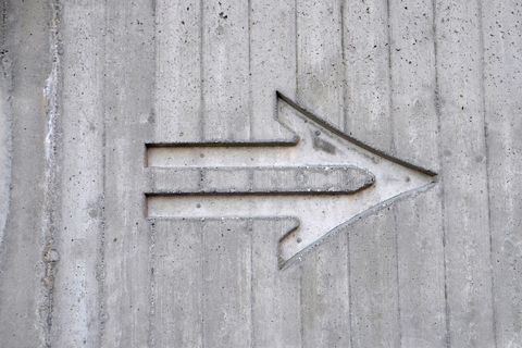 Concrete wall with etched arrow design