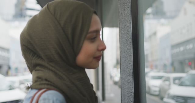 Young Woman Wearing Hijab Window Shopping in City - Download Free Stock Images Pikwizard.com