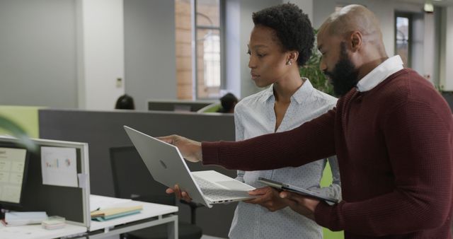 African American Colleagues Collaborating on Laptop in Modern Office - Download Free Stock Images Pikwizard.com