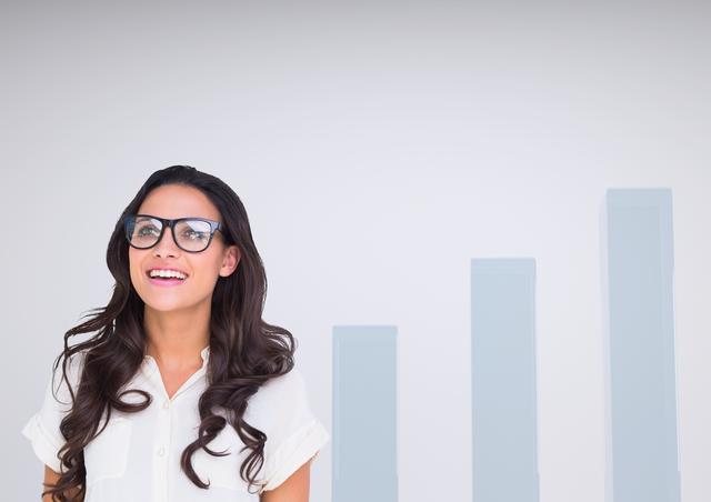 Digital composite of Woman with glasses happy against charts incrementing
