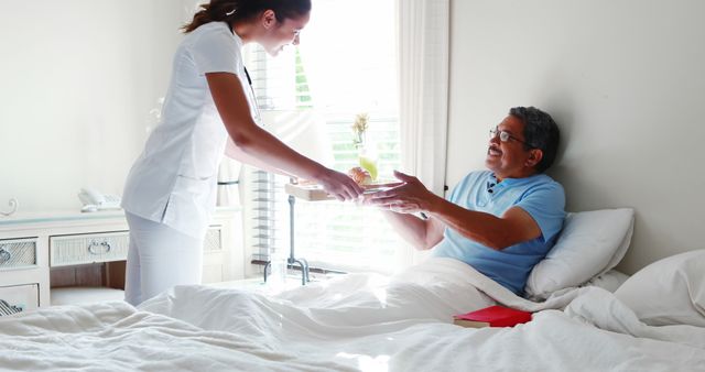 Nurse Providing Care to Elderly Man in Bed at Home - Download Free Stock Images Pikwizard.com