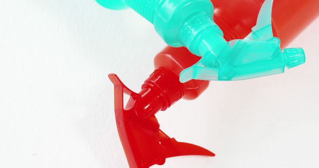 Close-up of Red and Blue Spray Bottle Nozzles on White Background - Download Free Stock Images Pikwizard.com