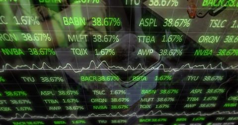 Financial Analyst Examining Real-Time Market Data on Multi-Screen Display