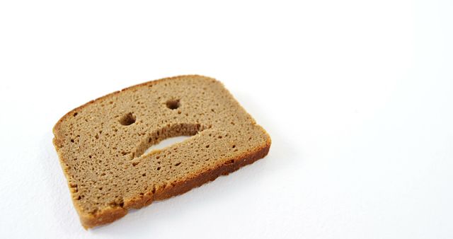 Sad Face Imprint on Slice of Whole Wheat Bread - Download Free Stock Images Pikwizard.com