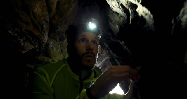 Explorer Wearing Headlamp in Dark Cave - Download Free Stock Images Pikwizard.com