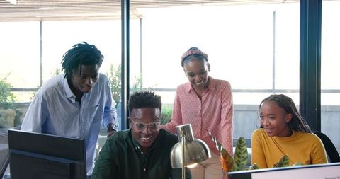 Team Celebrating Successful Project in Modern Office