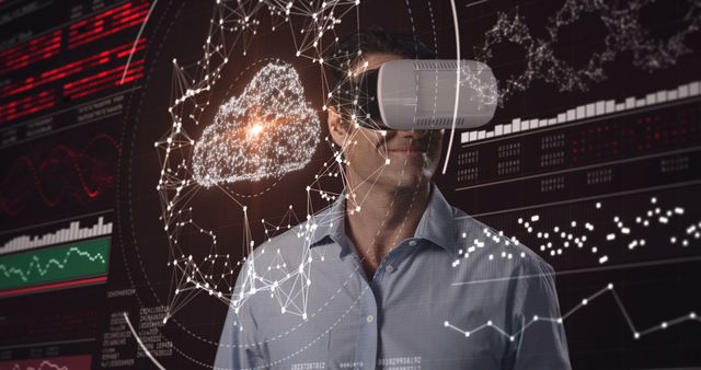 Attentive man using virtual reality headset and futuristic screen - Download Free Stock Photos Pikwizard.com